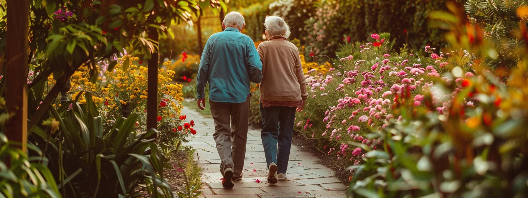 an elderly couple enjoying a peaceful walk in a beautiful garden, surrounded by vibrant flowers and lush greenery.